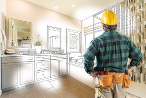a man planning a bathroom cabinet refacing project